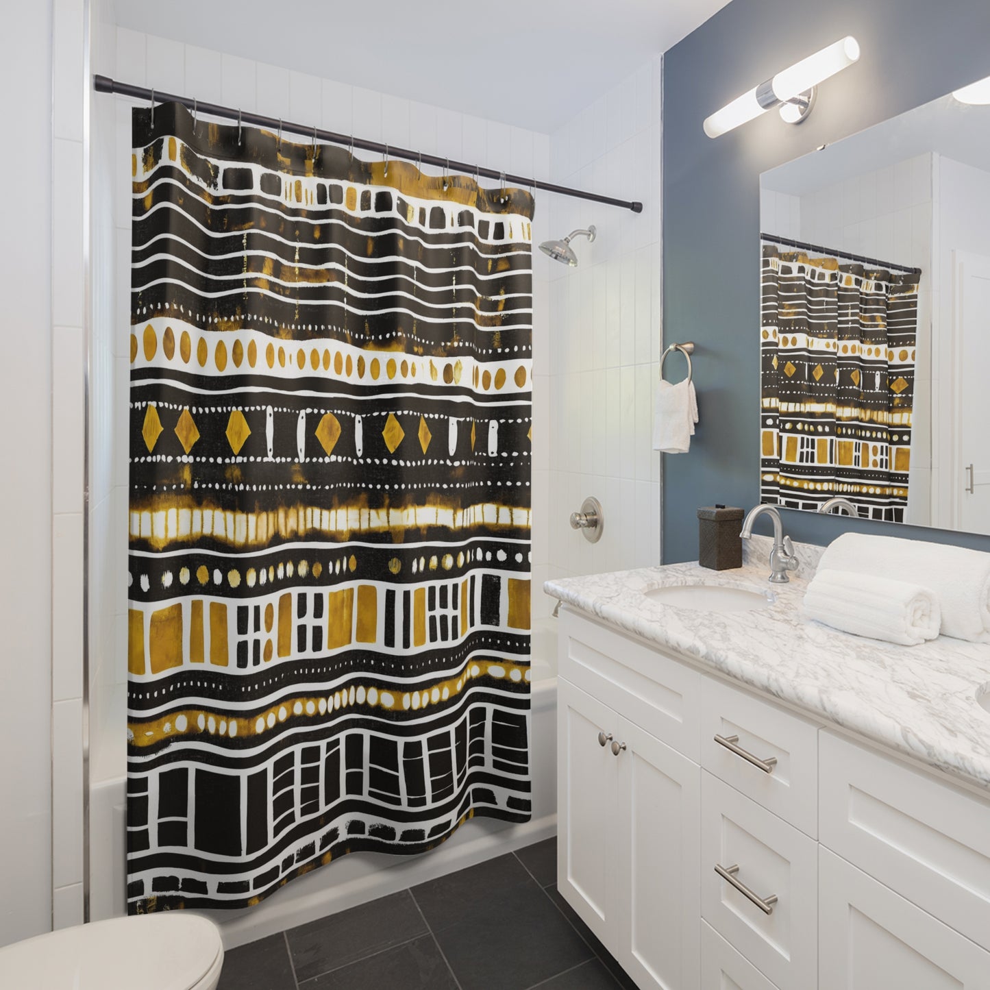 Bathroom with a patterned bathroom curtain, white vanity, and mirror.