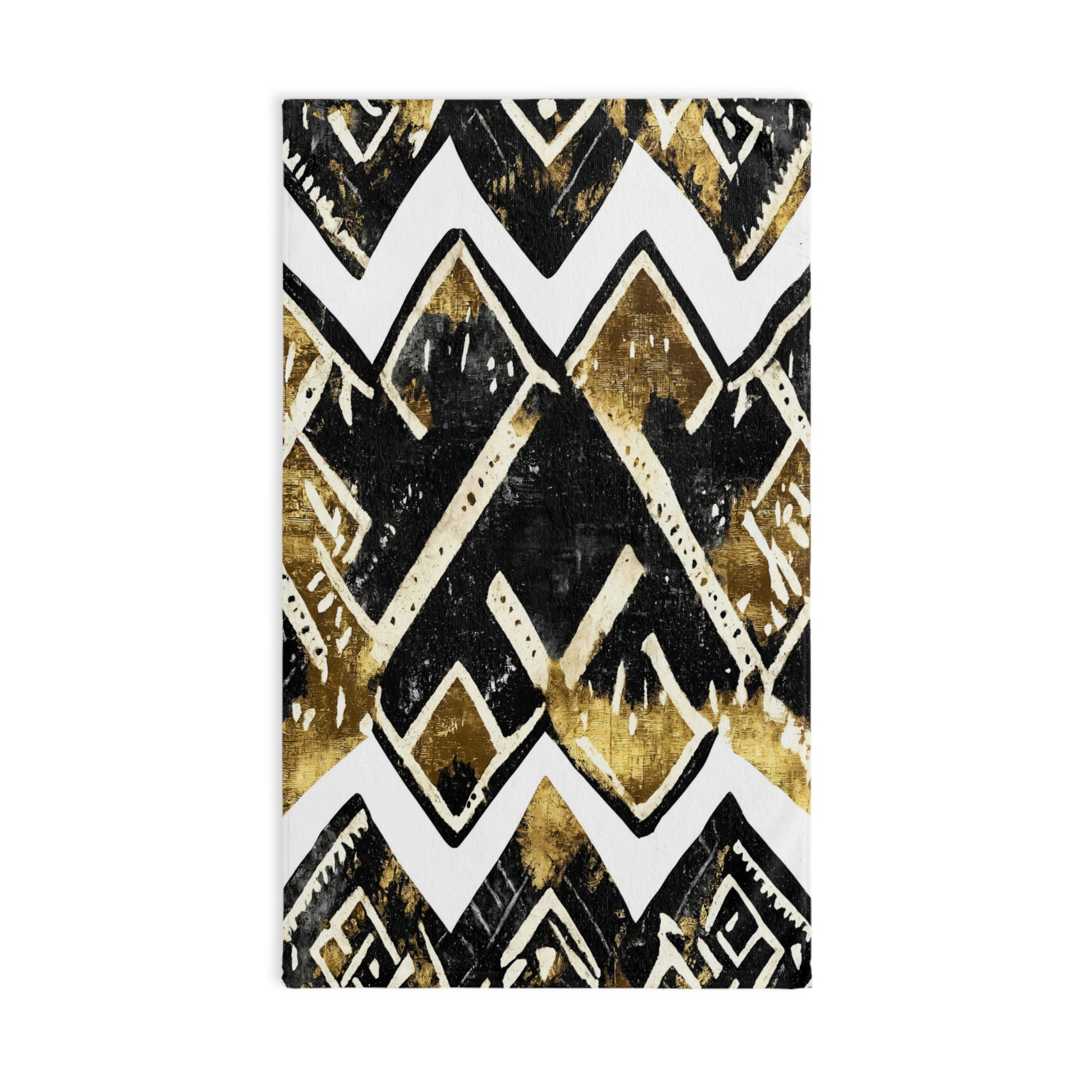 Mudcloth towel with black, gold, and white geometric pattern on a white background