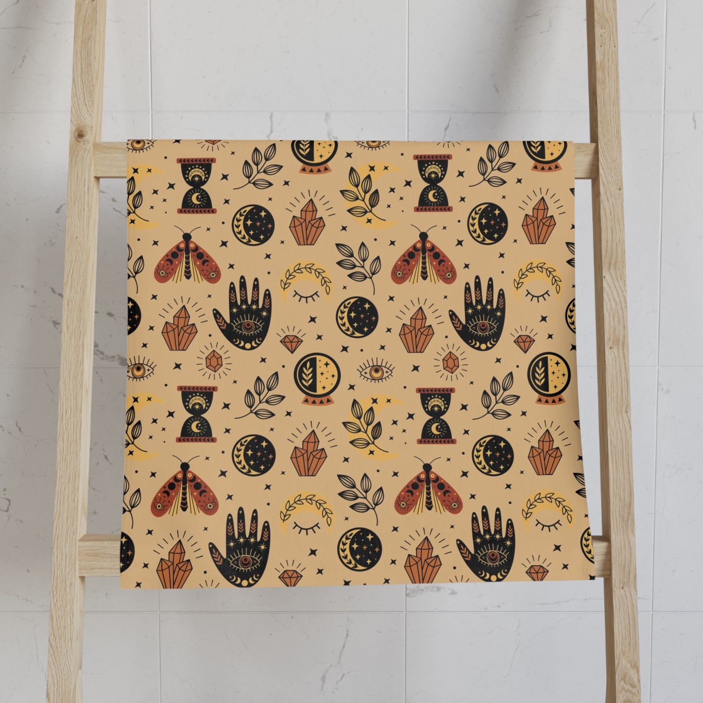 Patterned towel on a wooden ladder against a white wall