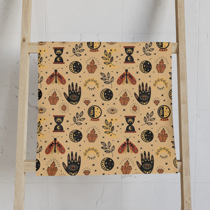 Patterned towel on a wooden ladder against a white wall