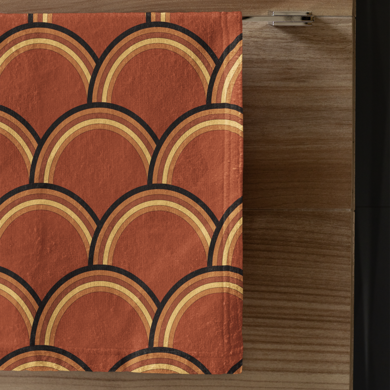 Red fabric with geometric pattern on a wooden surface