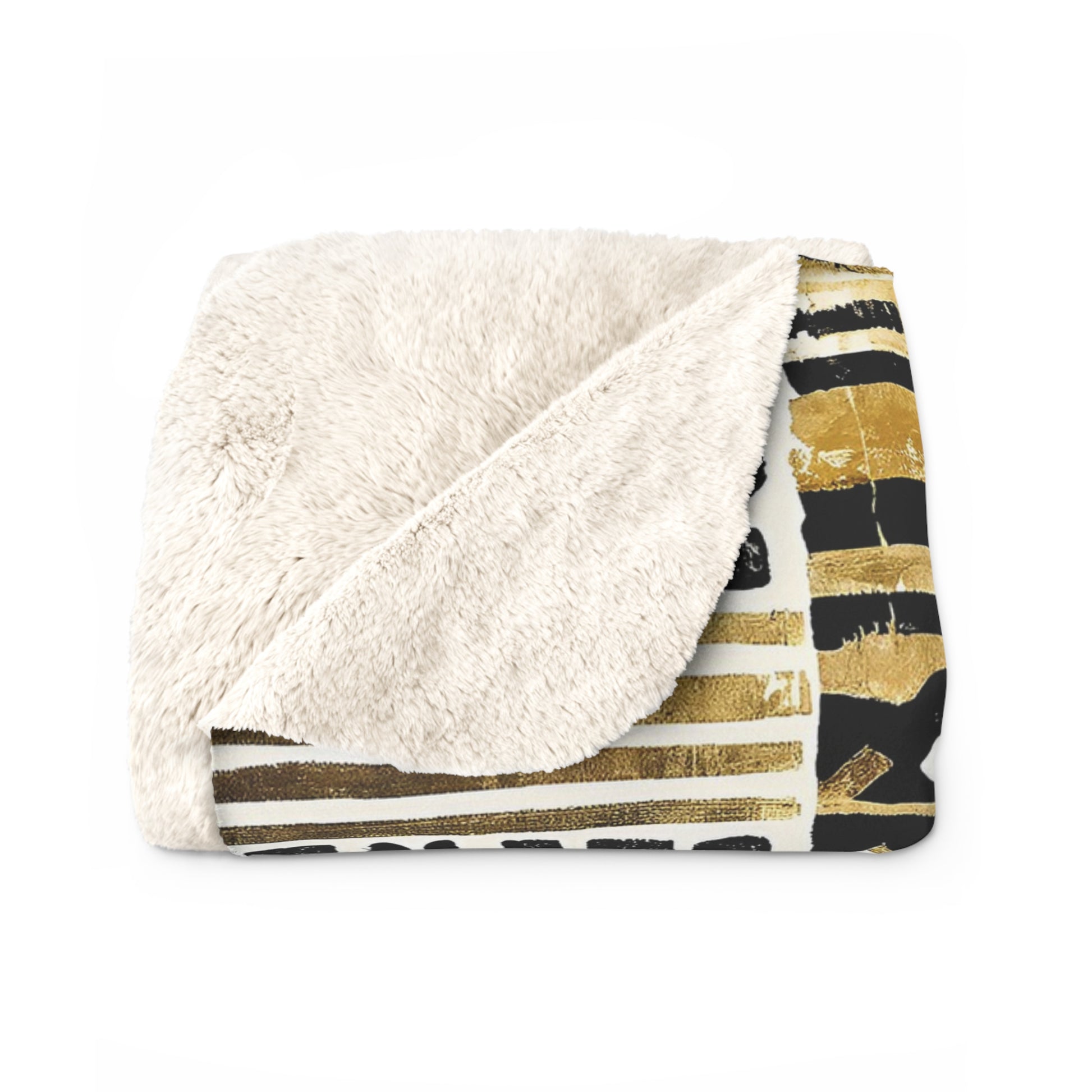 Blanket with gold and black abstract pattern on a white background