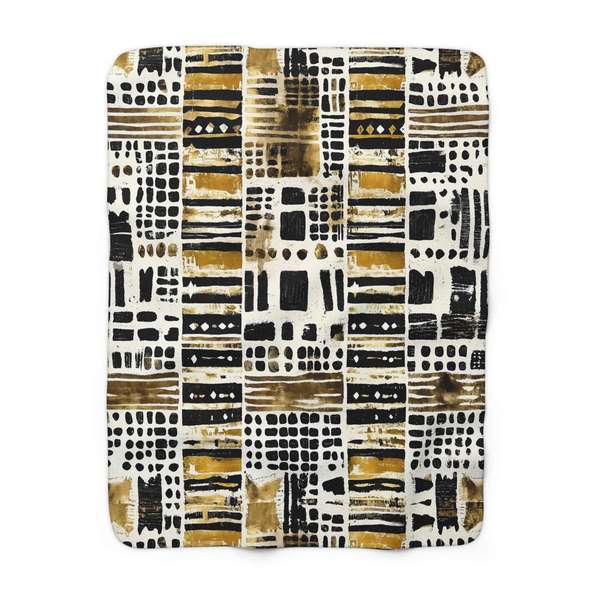 Patterned blanket with black, gold, and white design on a white background