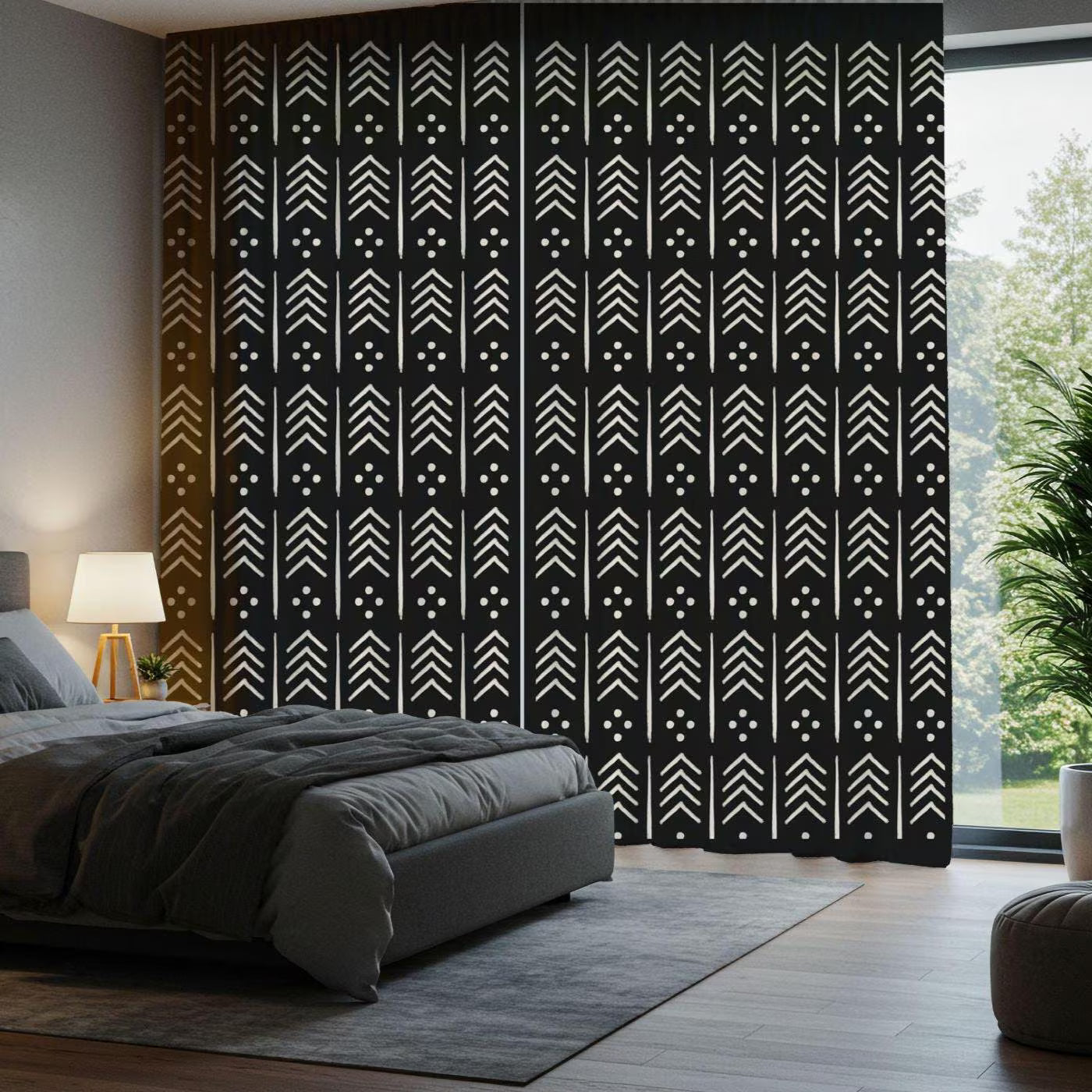 Bedroom with a black and white patterned curtain