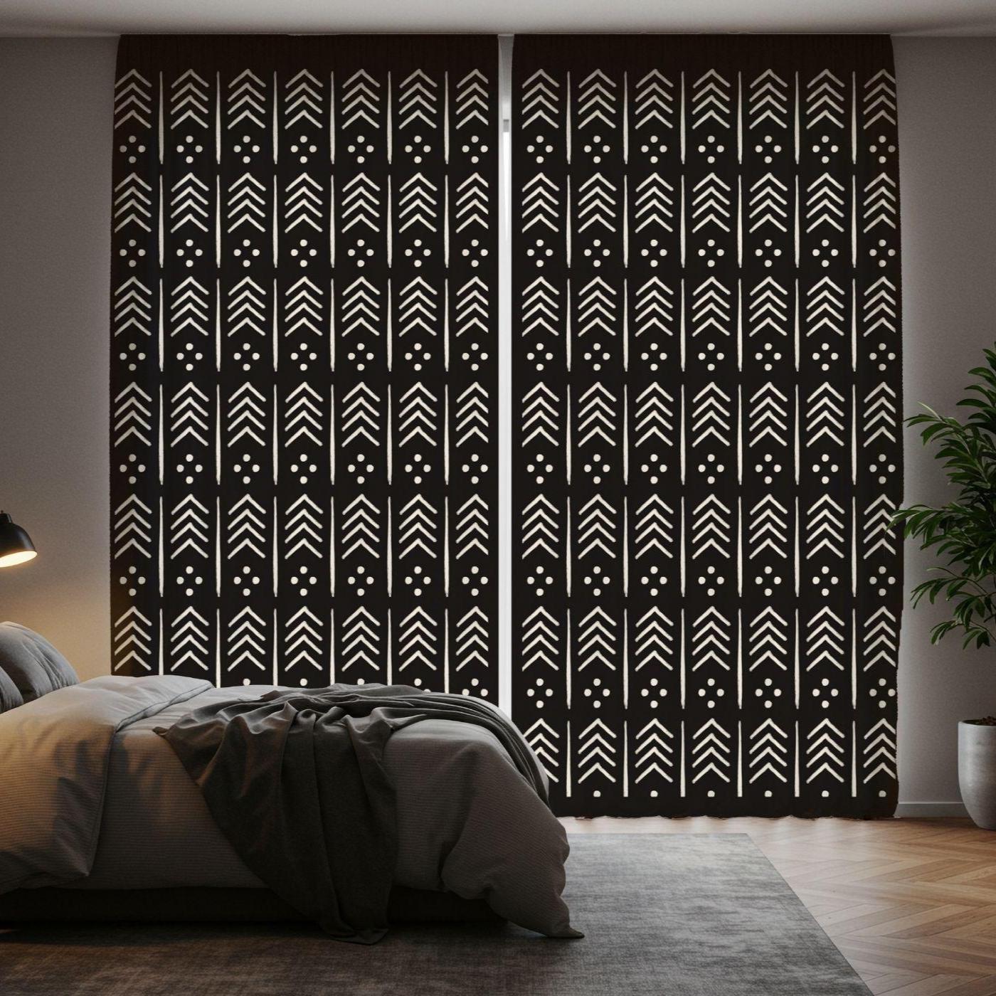 Black curtains with white geometric pattern in a bedroom setting