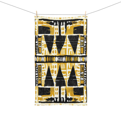 African print towel with black and yellow geometric pattern on a white background