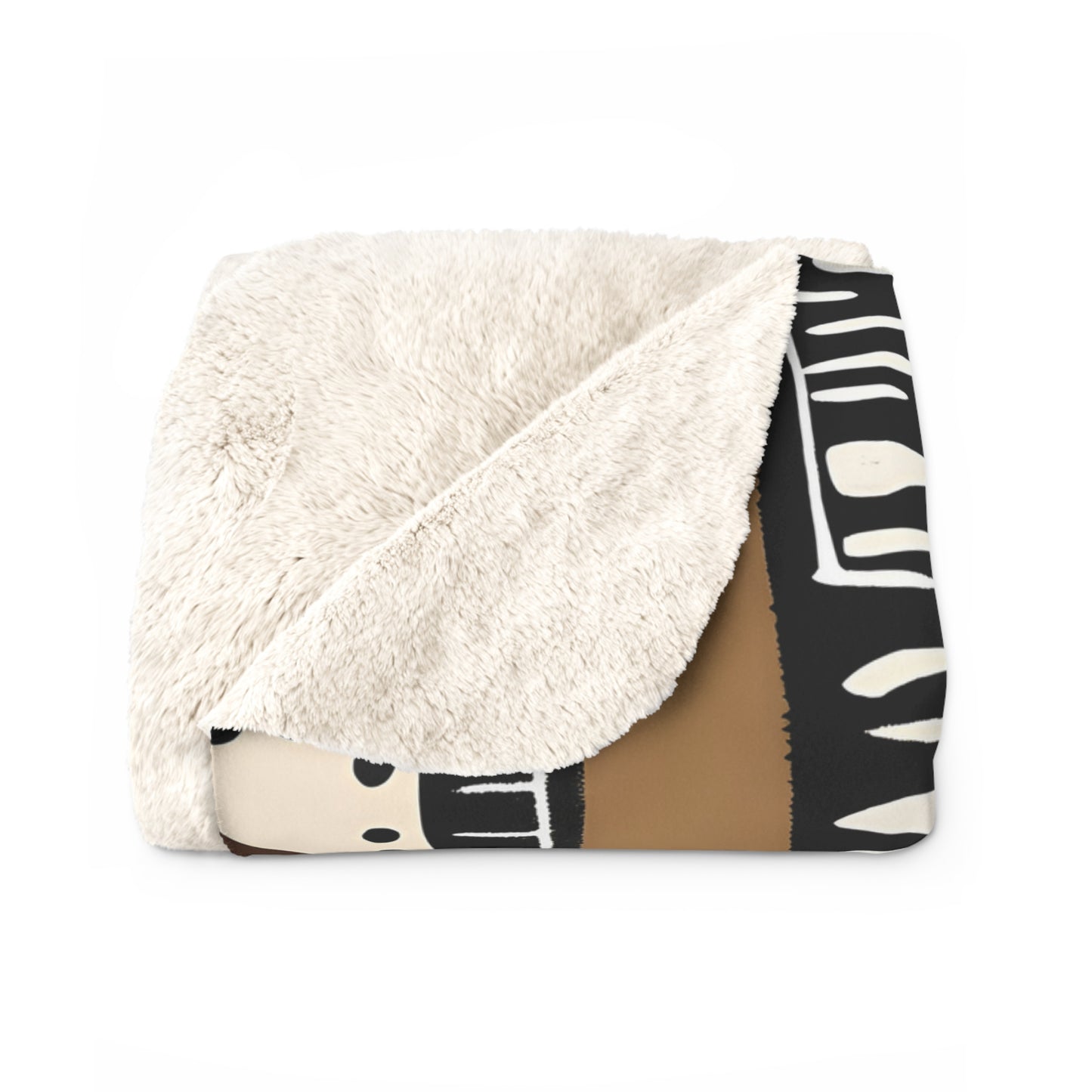 Folded blanket with white sherpa side and black and white abstract pattern on a white background
