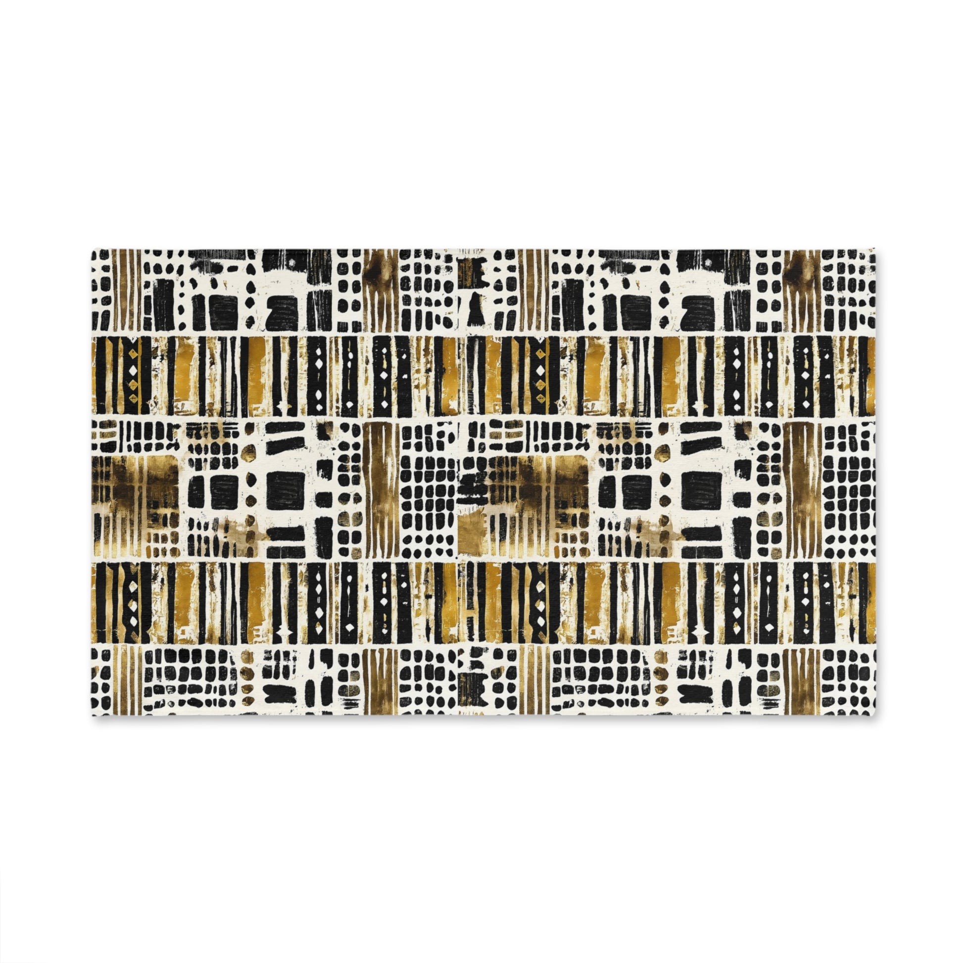 Patterned towel with black, gold, and white design on a white background