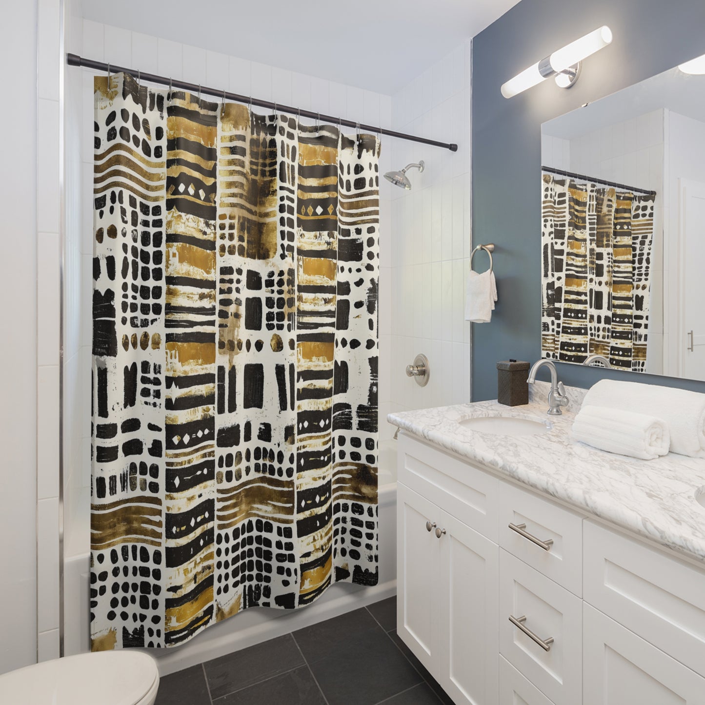 Bathroom with a african print shower curtains, sink, and mirror.
