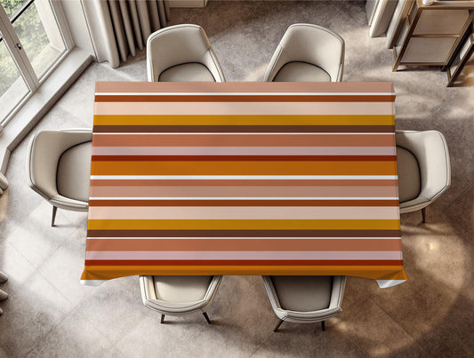 Dining table with a colorful striped tablecloth in a modern kitchen.