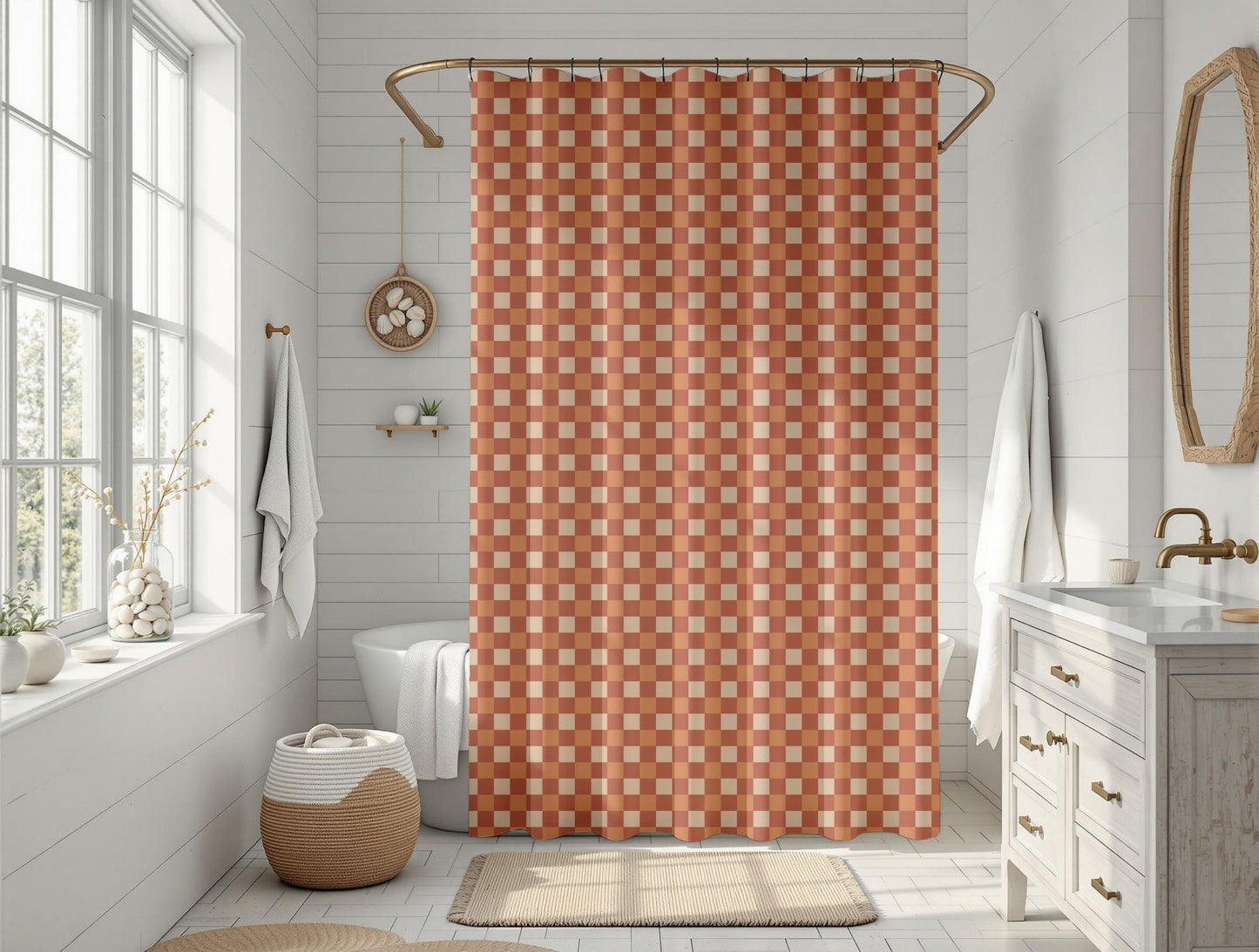 Bathroom with a patterned orange shower curtain, white toilet, sink, and decor.
