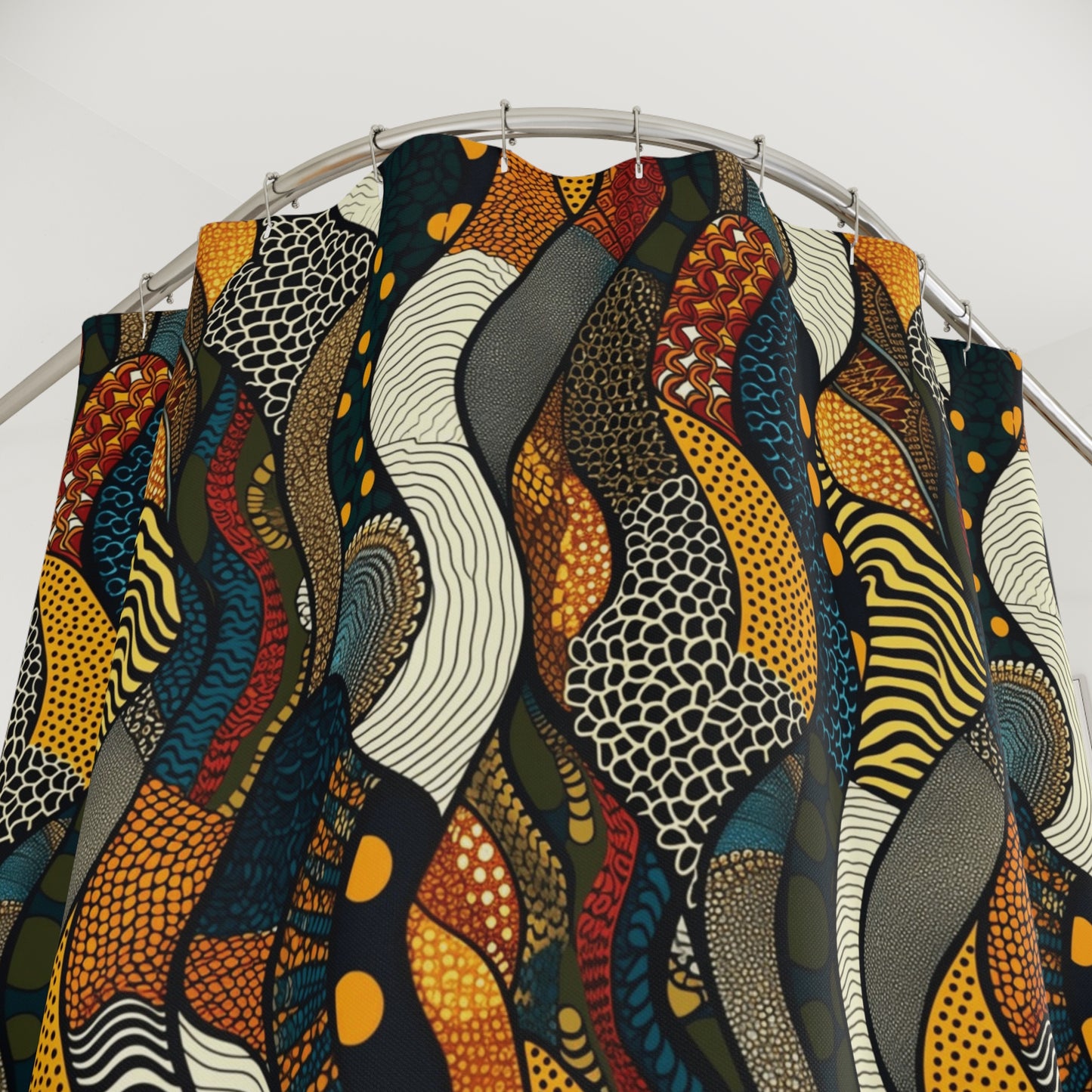 Colorful abstract patterned shower curtain on curved metal rod in modern bathroom