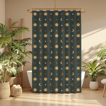 A dark teal shower curtain with a repeating celestial pattern of gold suns, crescent moons, and white stars, hanging in a bright, modern bathroom with potted plants and warm sunlight.
