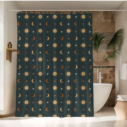 A dark teal shower curtain with a repeating pattern of smiling suns, crescent moons, and small stars, hanging in a bathroom next to a white bathtub and a potted plant.