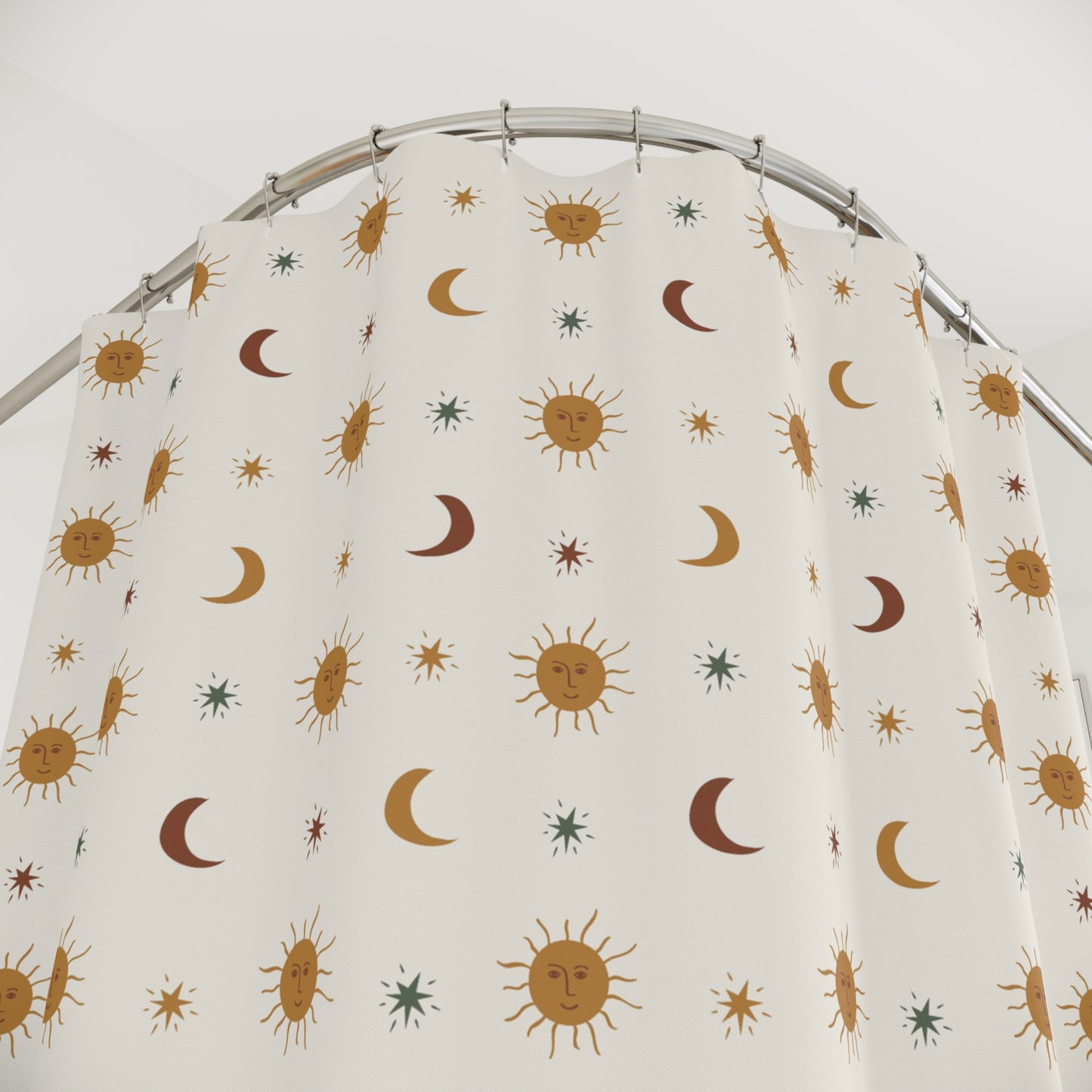 Fabric with celestial pattern on a hanger against a white background