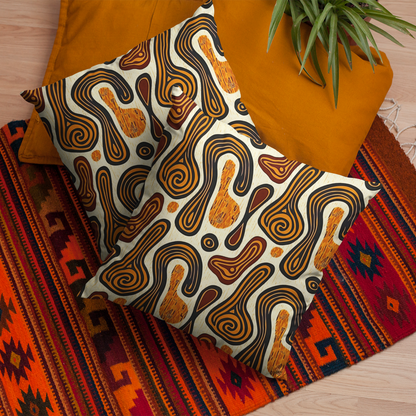 A set of decorative pillow covers with a tribal ethnic print, displayed on a colorful rug alongside a orange cushion.