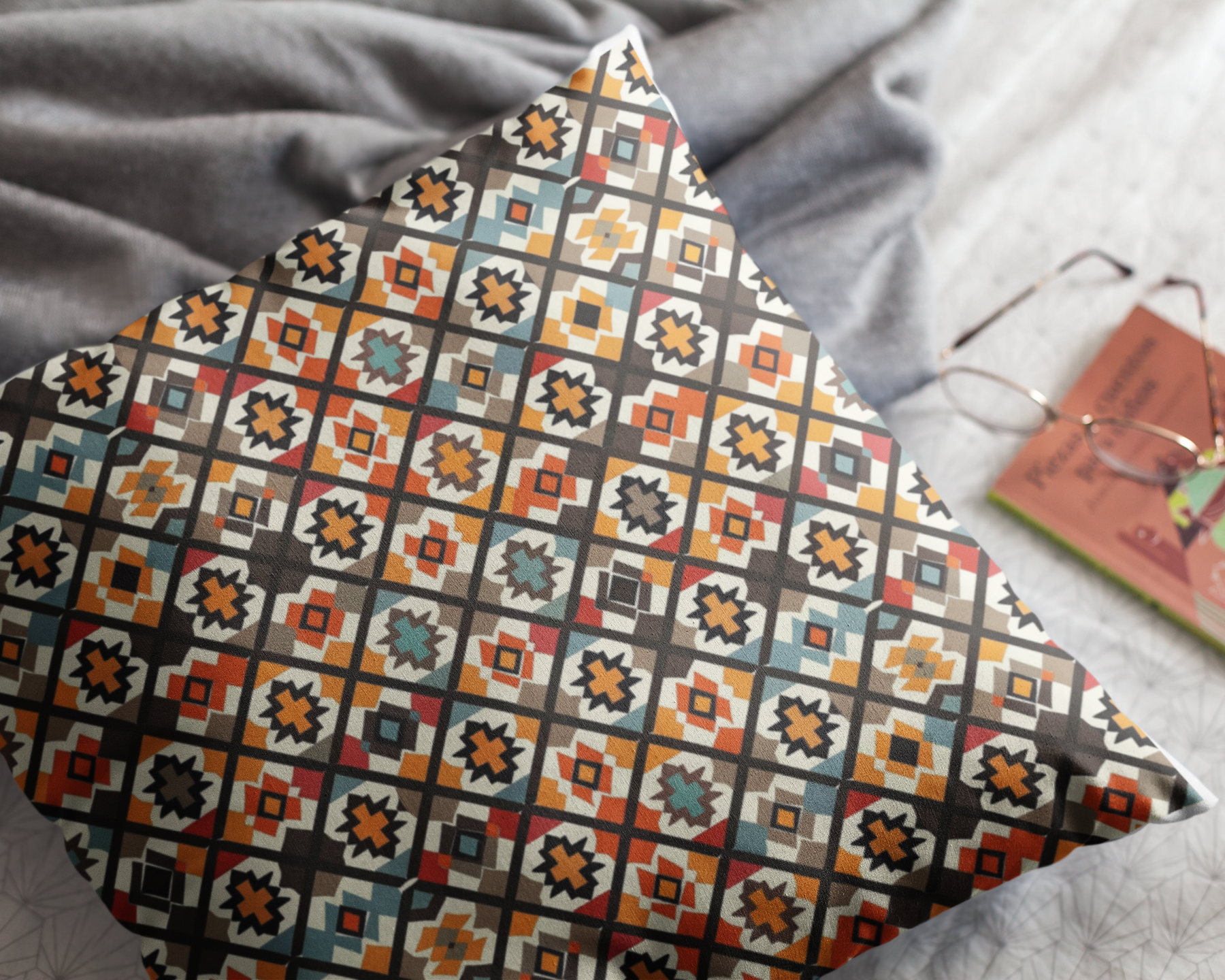 Decorative pillow with geometric pattern on a bed
