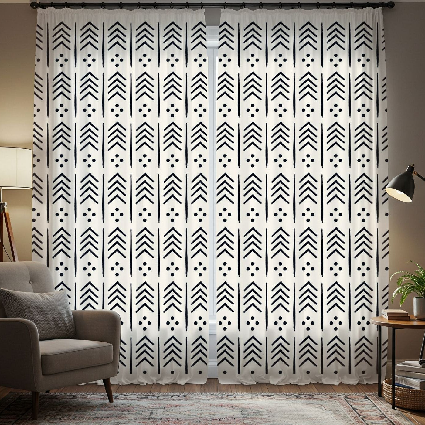 Living room with tribal patterned curtains, bookshelves, and a lamp.