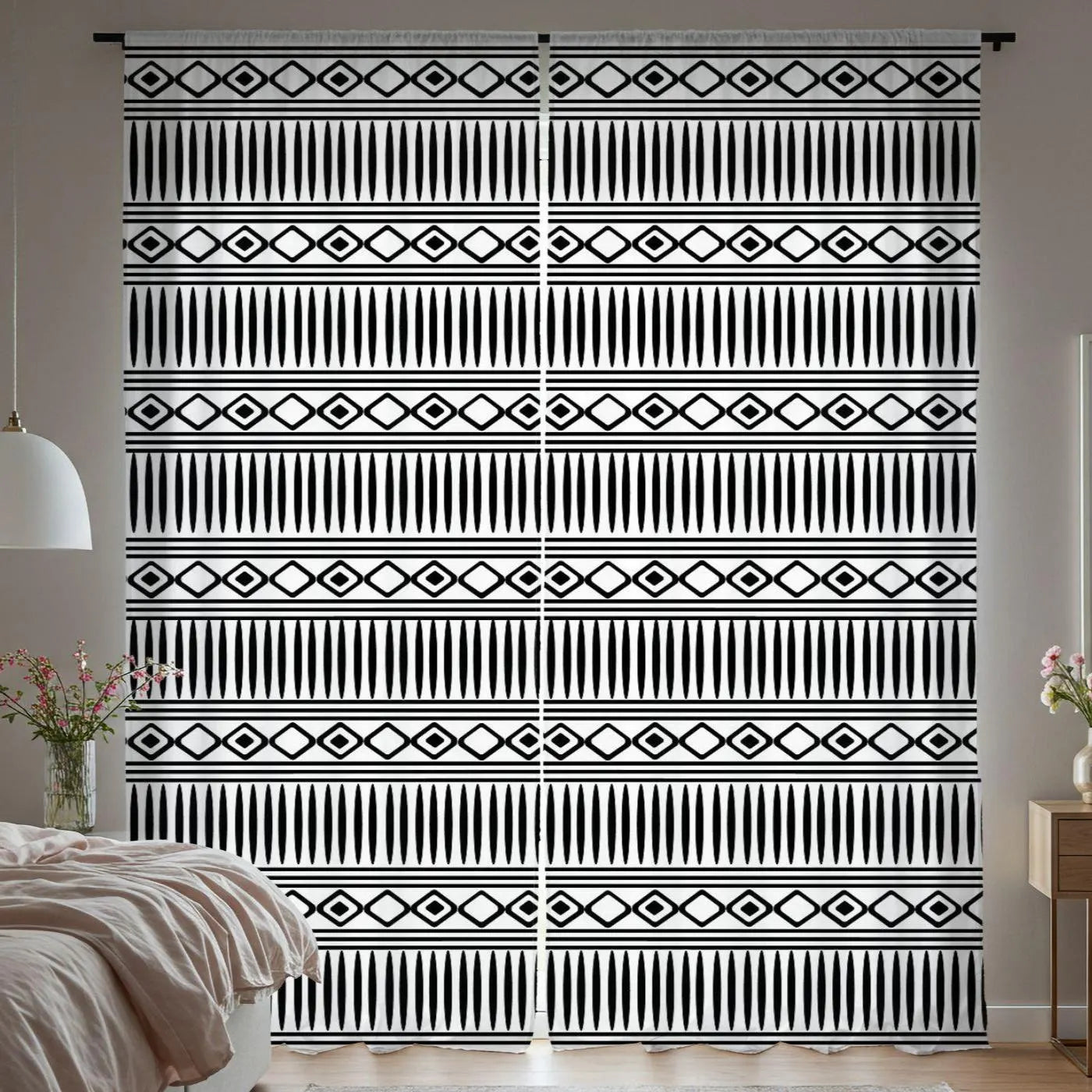 Black and white patterned curtains in a bedroom setting