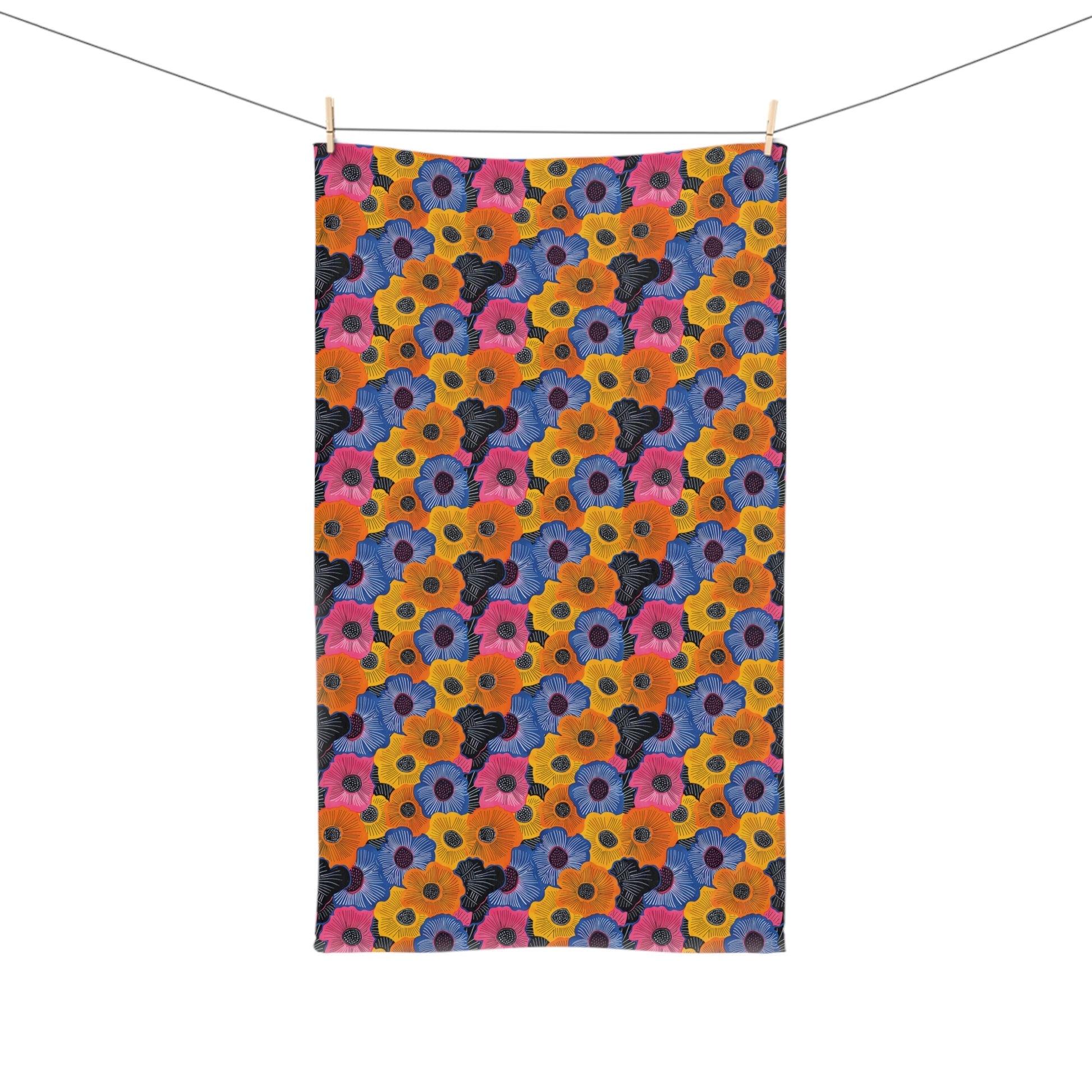 Colorful floral patterned towel hanging on a line.