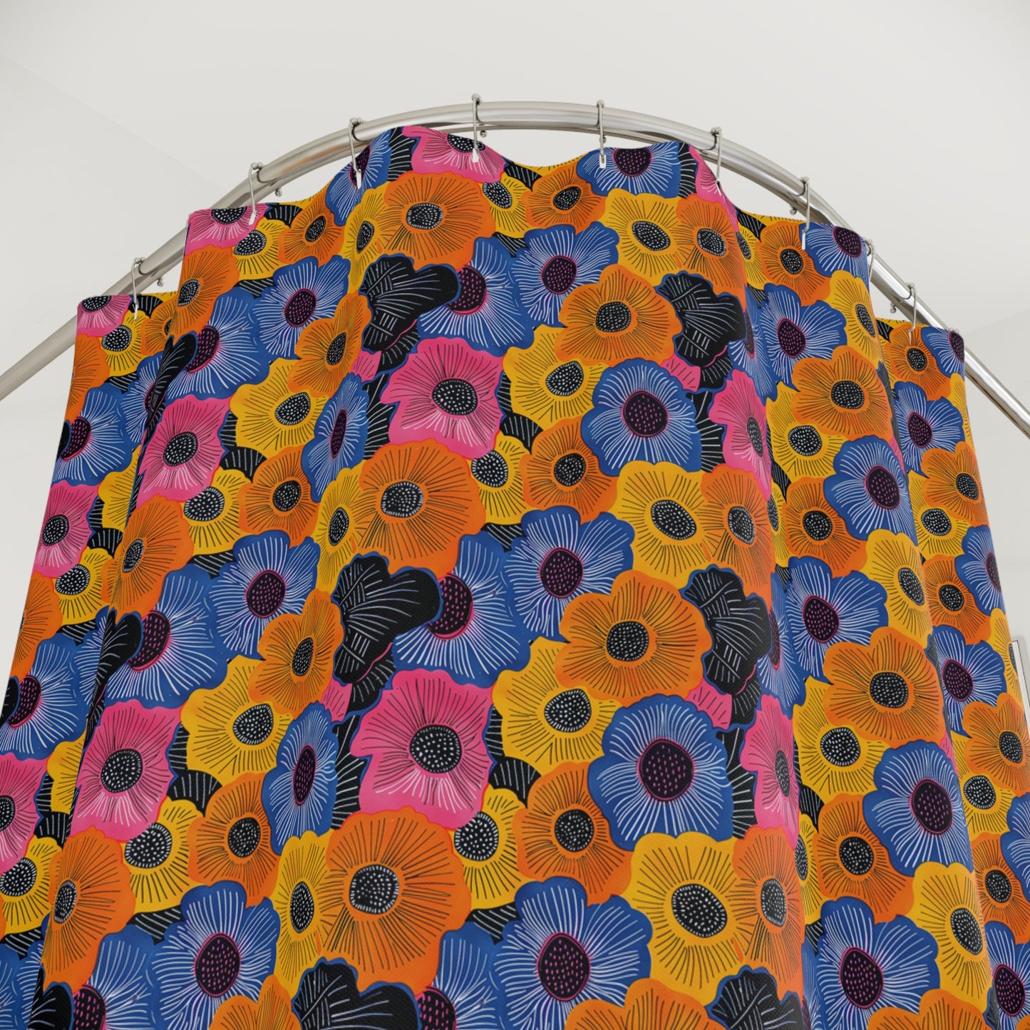 Colorful floral patterned fabric on a metal rod against a white background