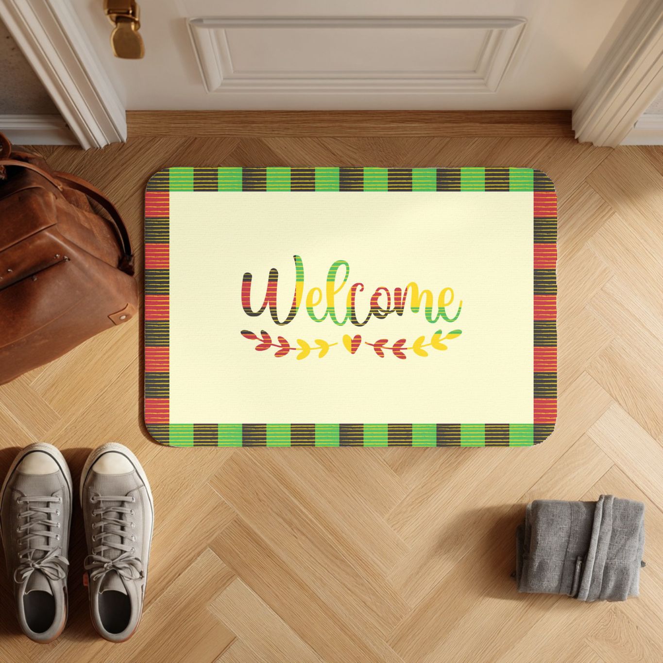 Decorative doormat with 'Welcome' text on a wooden floor, next to shoes and a bag.