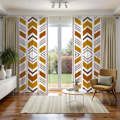 A room with Bogolan Mudcloth Blackout Window Curtains featuring a geometric tribal pattern in black, white, and yellow. The curtains are hanging in a window with a chair and decorative items in the foreground.