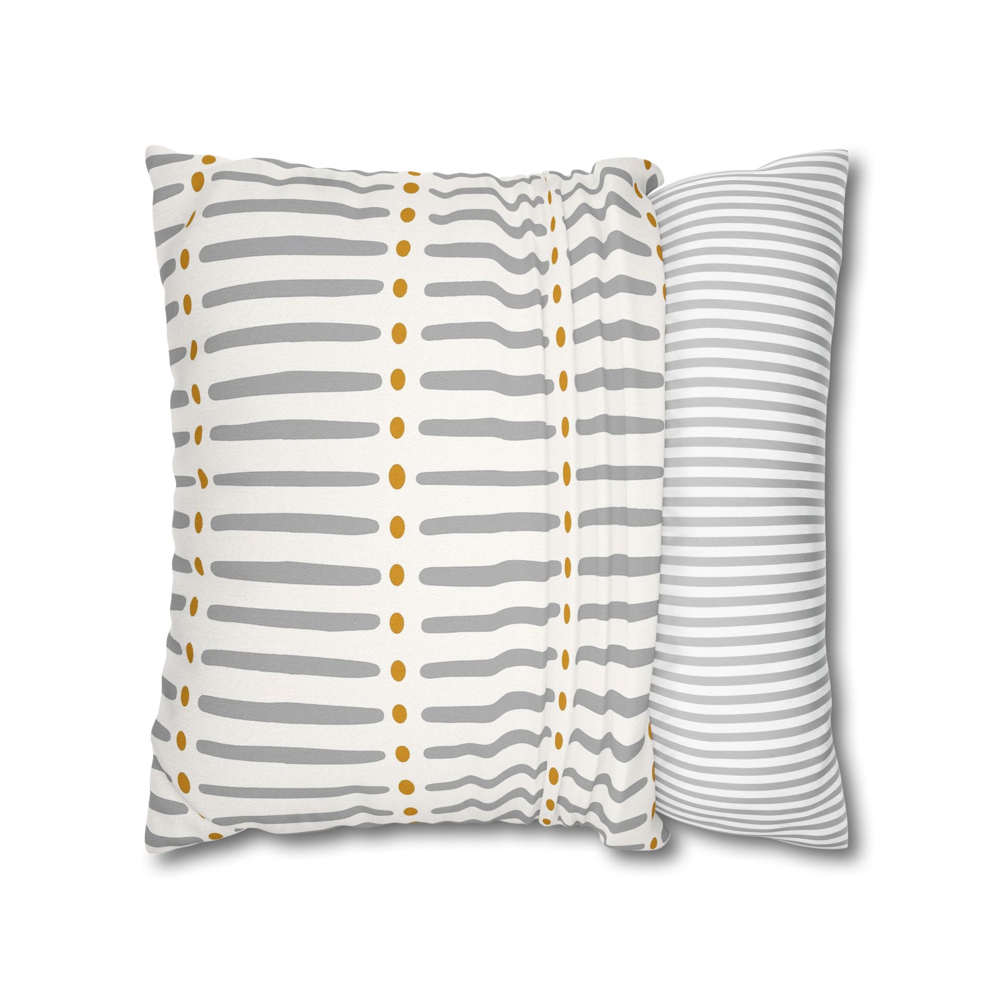 Two patterned pillows on a white background