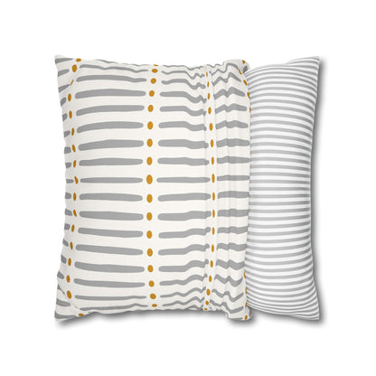 Two patterned pillows on a white background