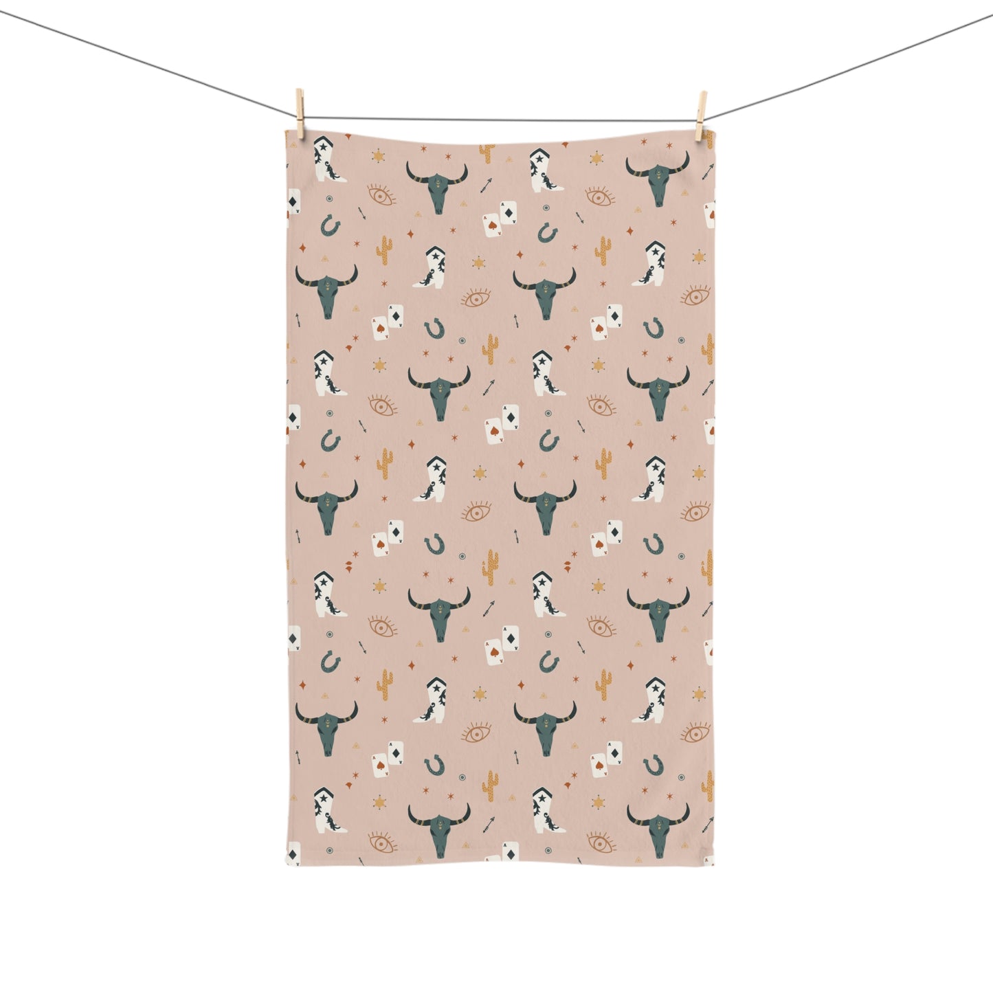 Towel with bull and cow pattern on a pink background