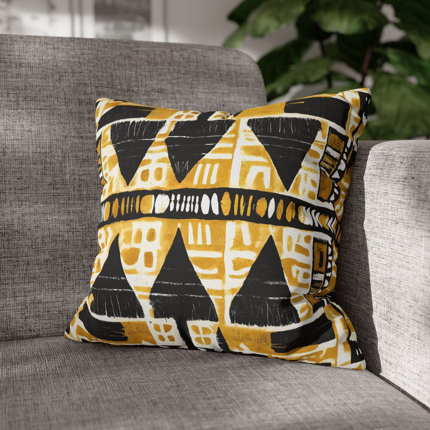 Decorative pillow with geometric pattern on a gray sofa