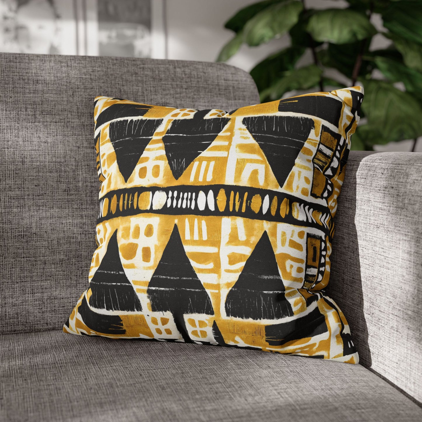 Decorative pillow with geometric pattern on a gray sofa