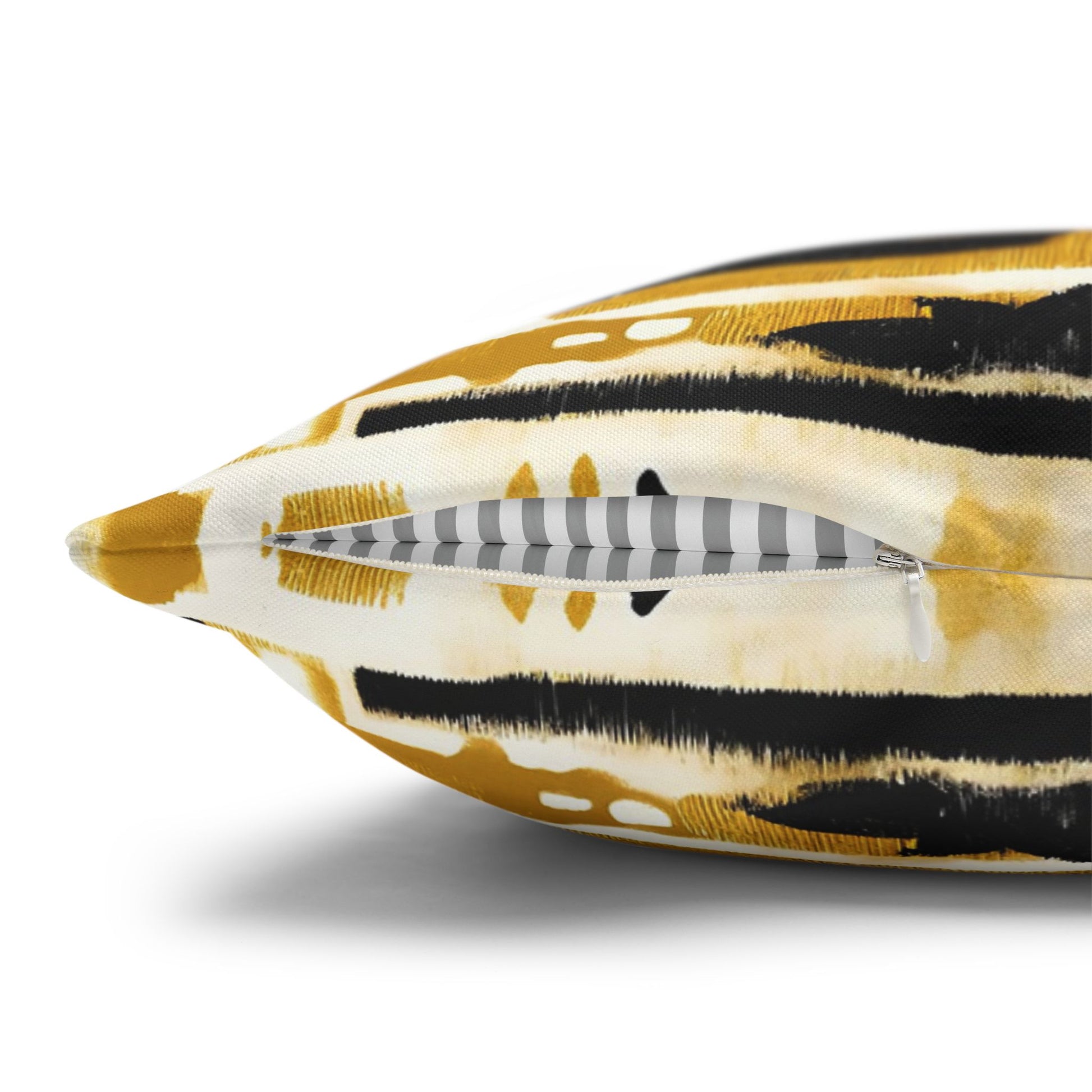 Close-up of a decorative pillow with a tiger stripe pattern on a white background