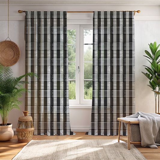 A pair of gray checkered blackout curtains hanging in a room with a window, showcasing a patterned design.