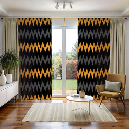A room with bold black, gold, and gray zigzag mudcloth print blackout curtains hanging on a window, with a chair, a vase with a plant, and a decorative object on the foreground.