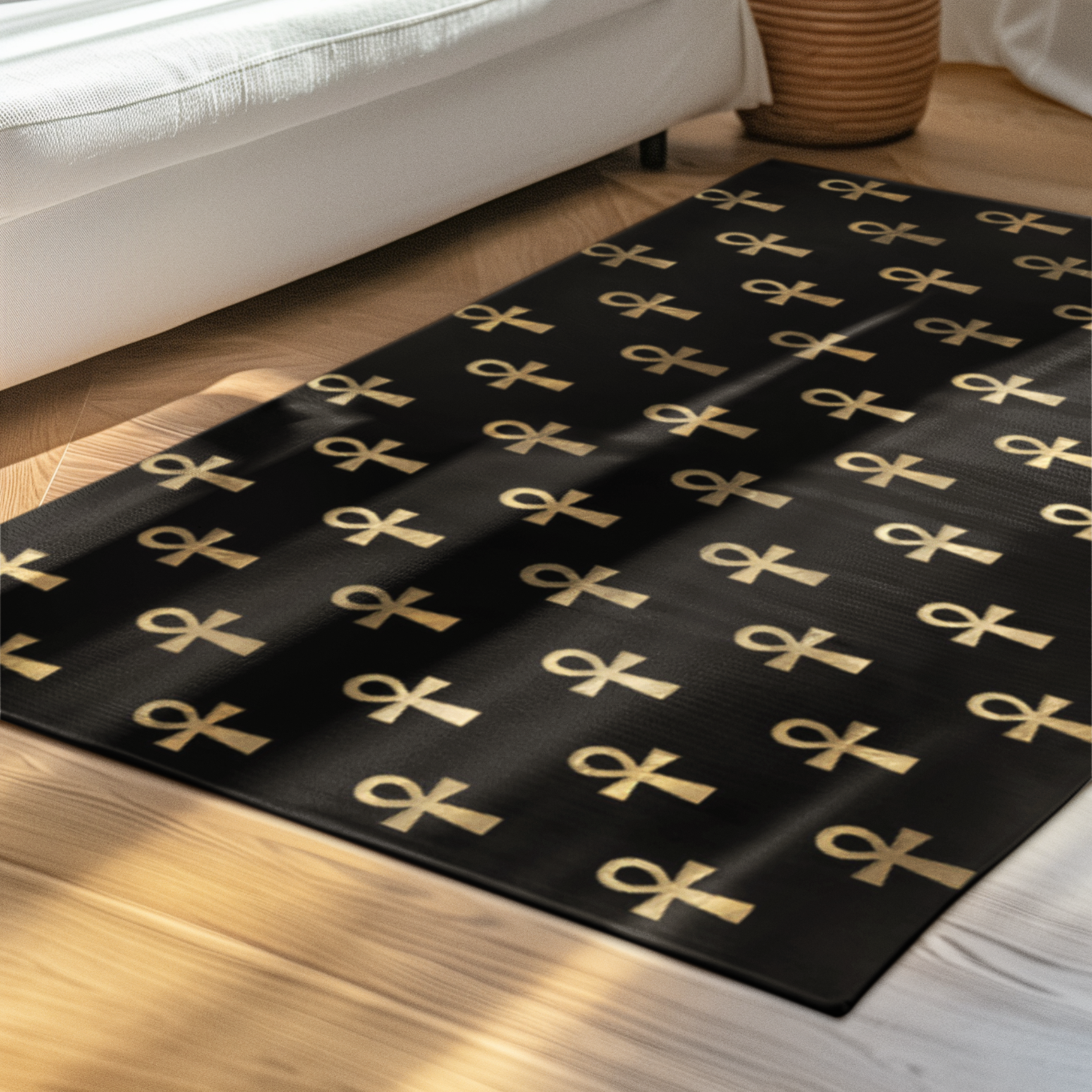Black floor mat with gold ankh pattern in a modern living room with white sofa and plant