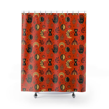 Shower curtain with celestial and hamsa hand pattern on a red background