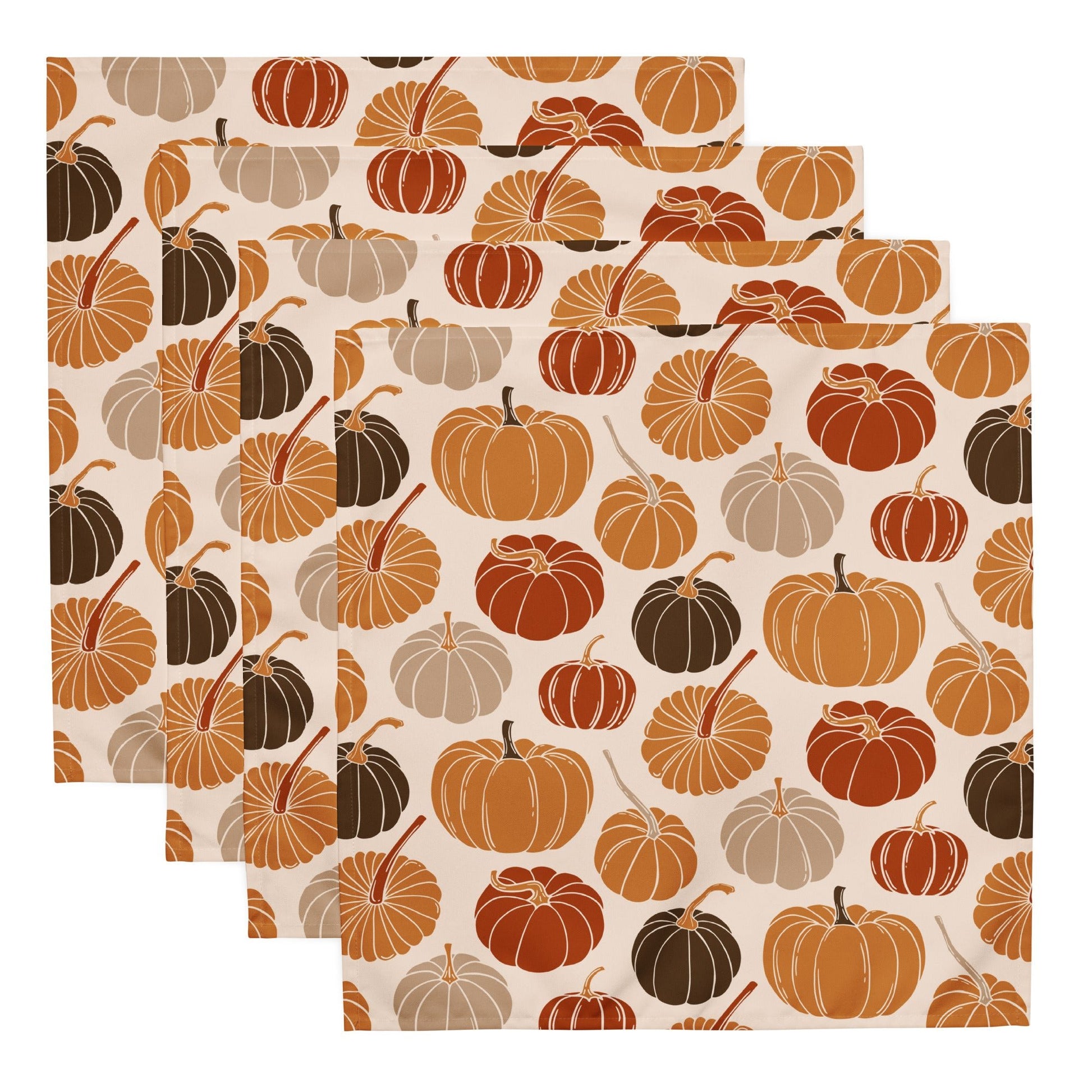 Set of two pumpkin-patterned placemats on a white background